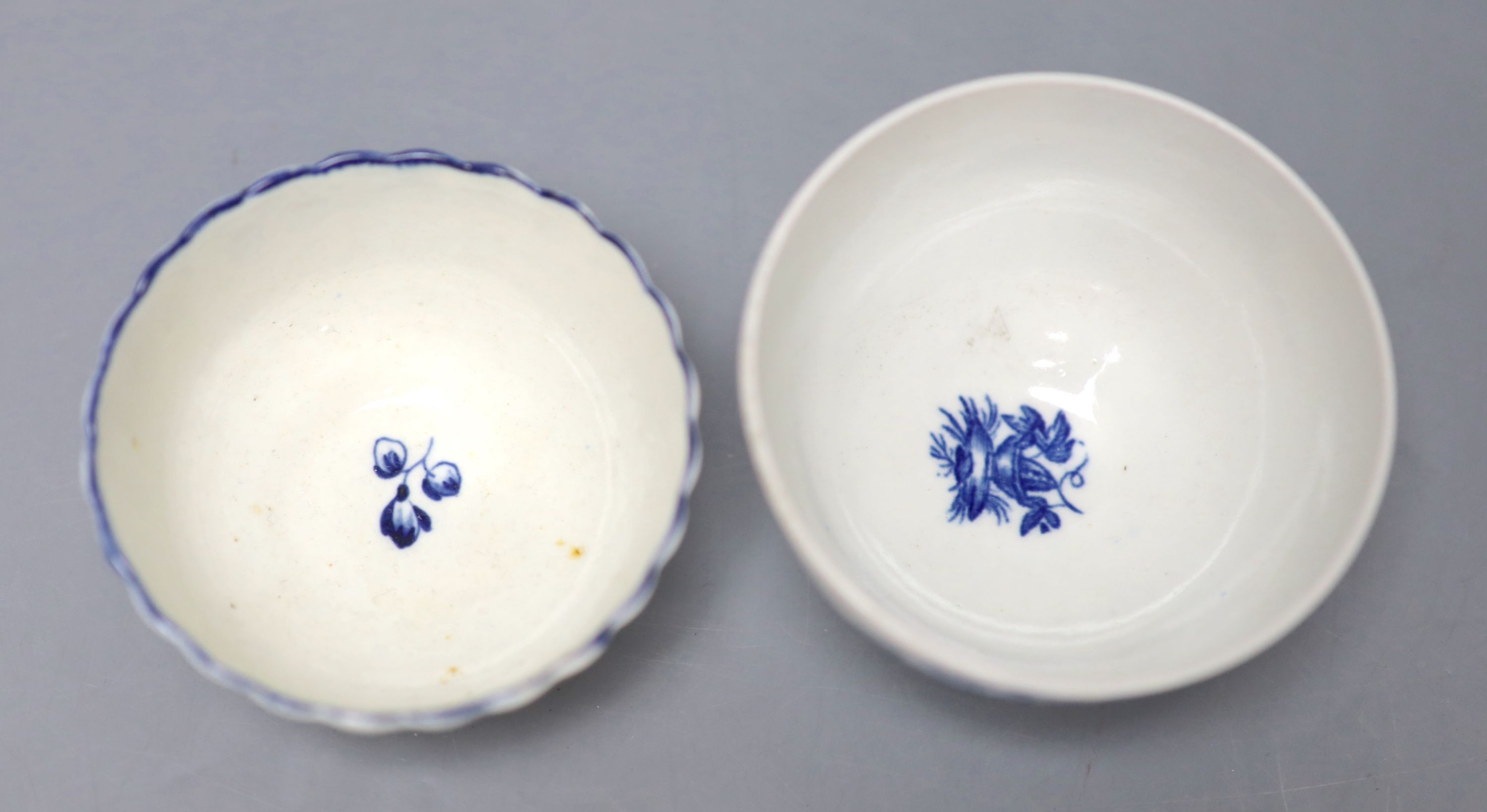 An 18th century Worcester teabowl and saucer Gilliflower pattern and another with mother and child pattern, all with crescent marks